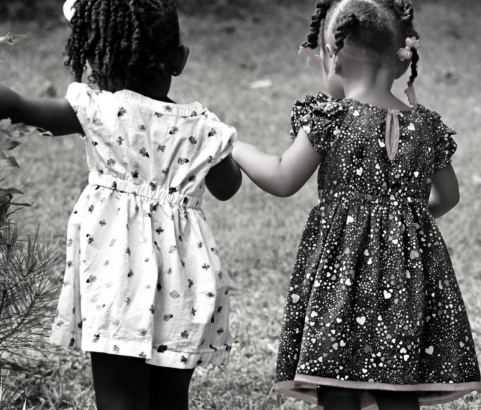 2 little girls holding hands
